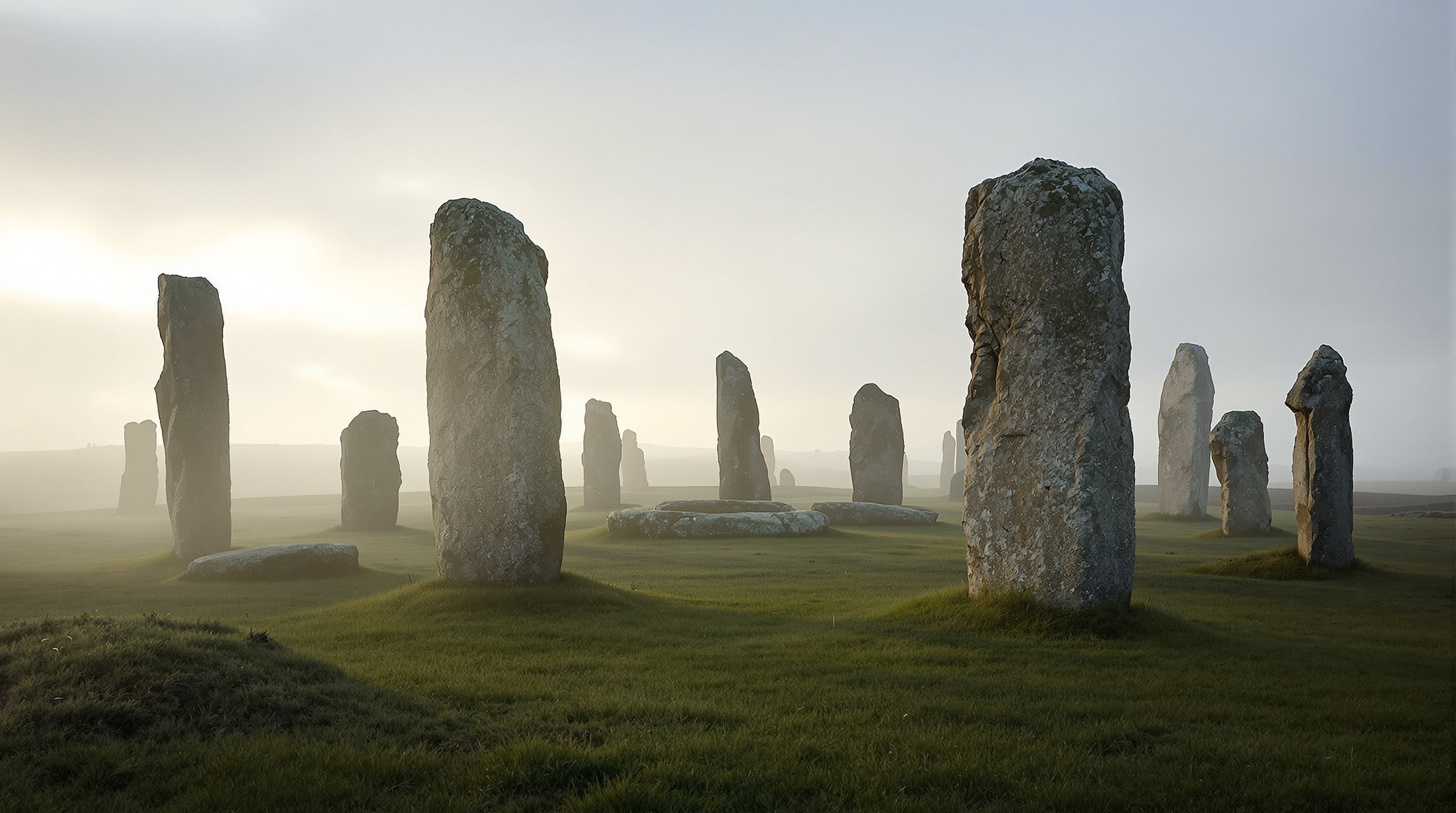 Ancient megalithic standing stones in Brittany morning mist